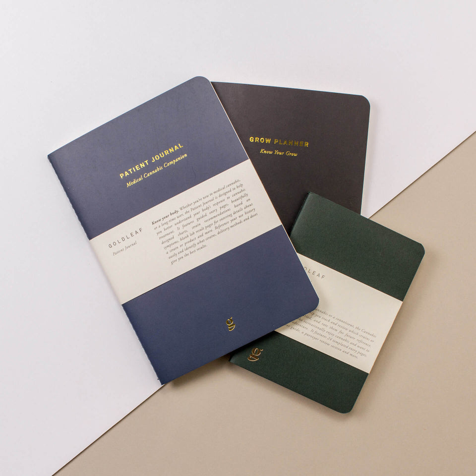 A curated collection of Goldleaf cannabis journals, including the Patient Journal, Cannabis Taster, Cooking Journal, and Pet Jotter logbooks for tracking botanical data.